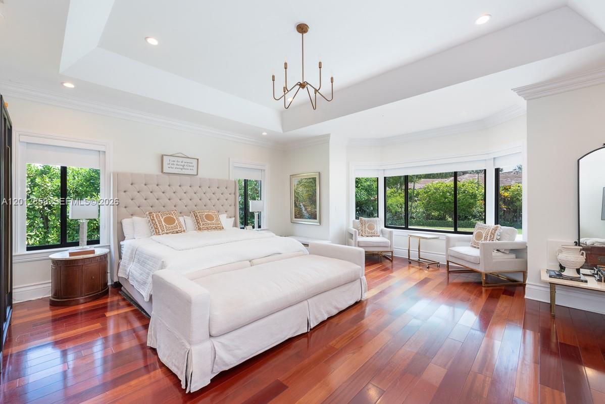 12311 Southwest 94th Avenue Miami, FL 33176 - Photo 11 of 32 a spacious bedroom with a large bed and a large window