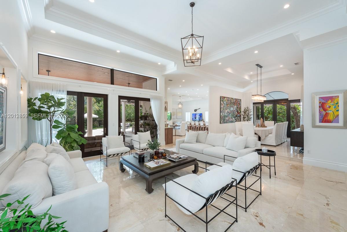12311 Southwest 94th Avenue Miami, FL 33176 - Photo 5 of 32 a living room with lots of furniture and a chandelier
