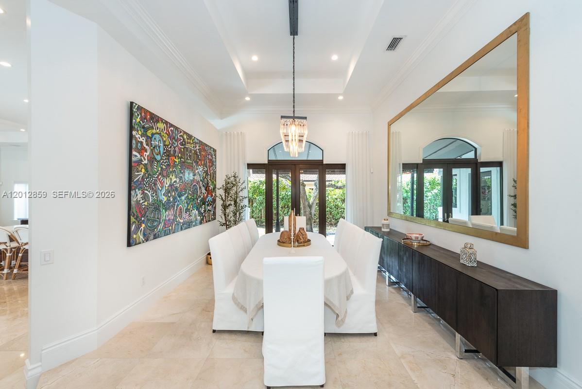 12311 Southwest 94th Avenue Miami, FL 33176 - Photo 6 of 32 a dining room with furniture a chandelier and window