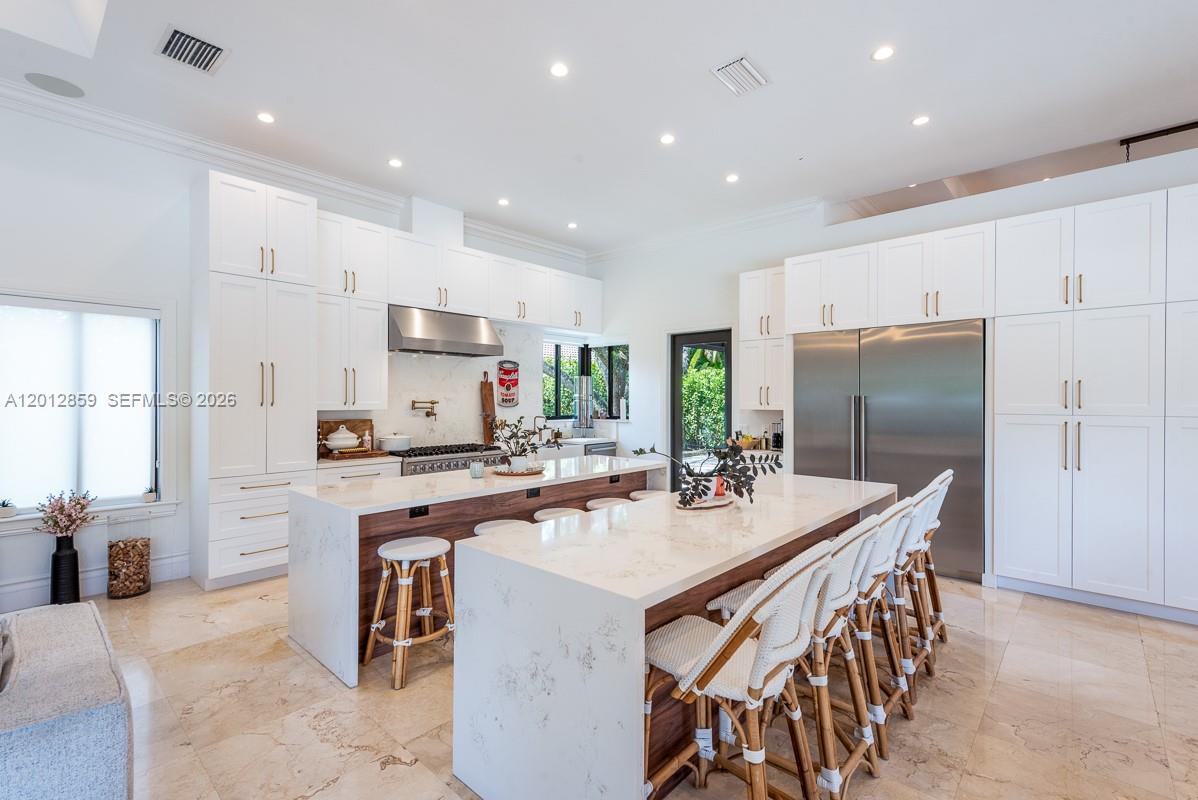 12311 Southwest 94th Avenue Miami, FL 33176 - Photo 8 of 32 a kitchen with stainless steel appliances kitchen island granite countertop a sink and a refrigerator