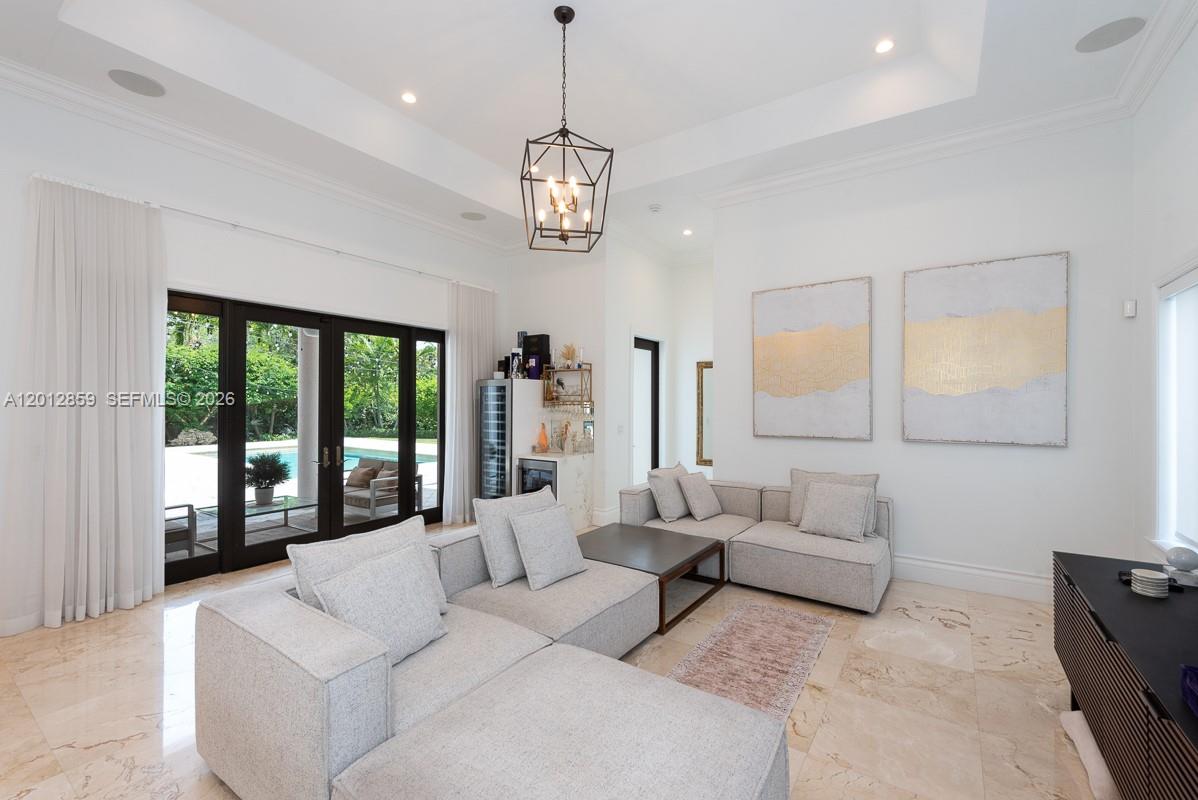 12311 Southwest 94th Avenue Miami, FL 33176 - Photo 10 of 32 a living room with furniture ceiling fan and a large window