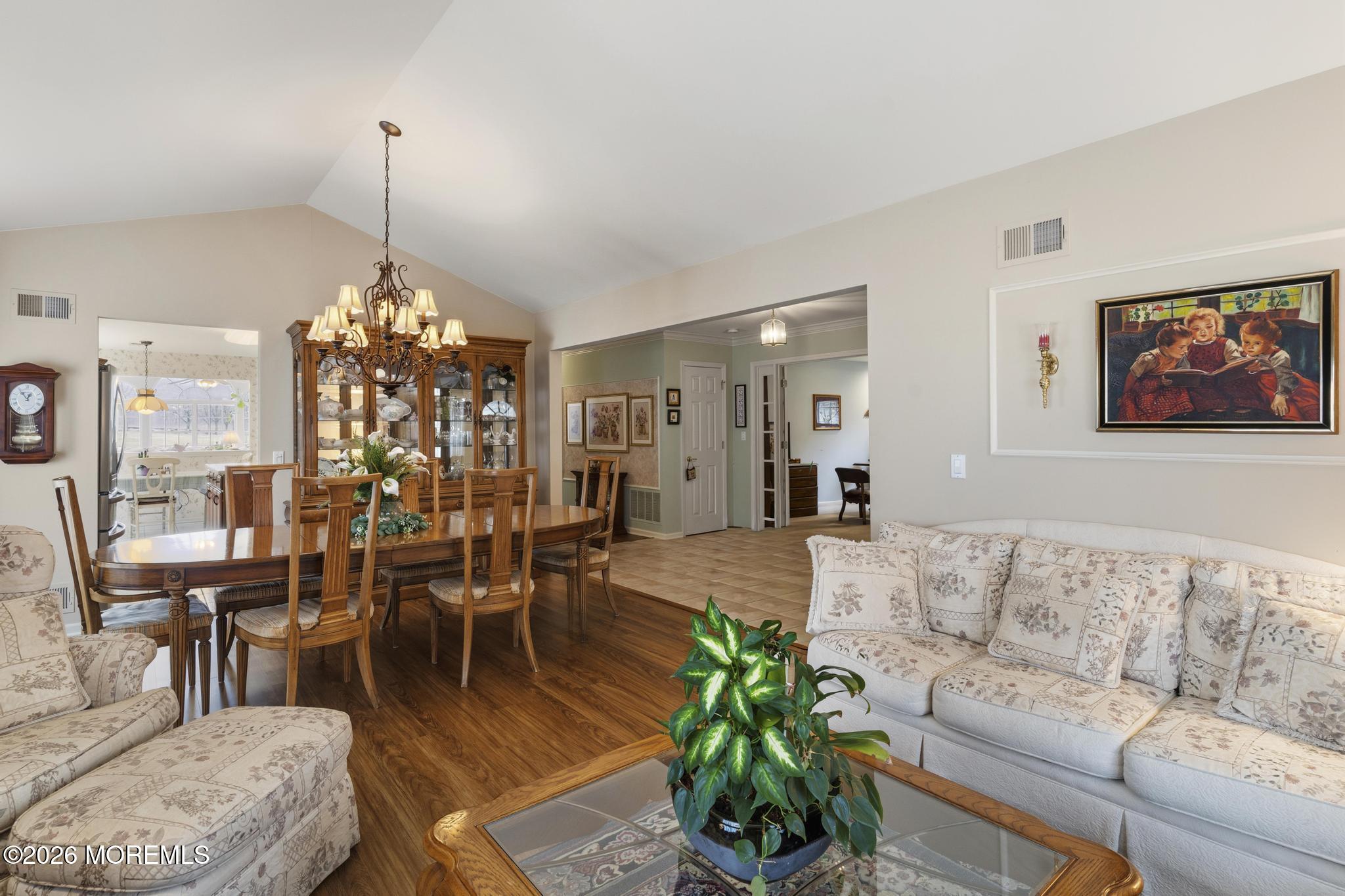 62 Ivy Hill Road Lakewood, NJ 08701 - Photo 14 of 62 a living room with furniture and a chandelier