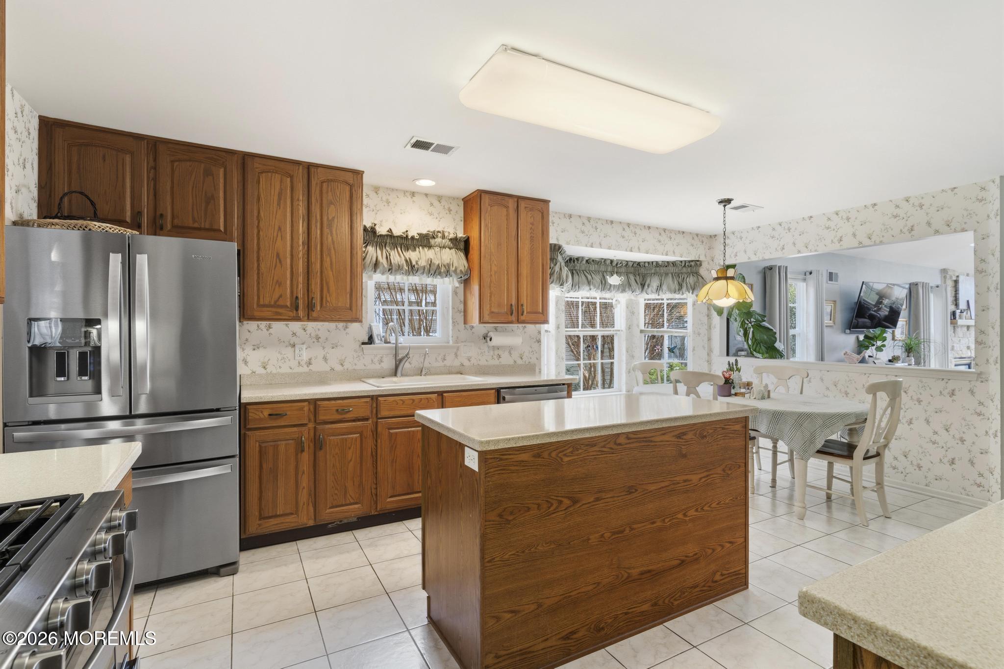 62 Ivy Hill Road Lakewood, NJ 08701 - Photo 18 of 62 a kitchen with a sink counter top space and stainless steel appliances