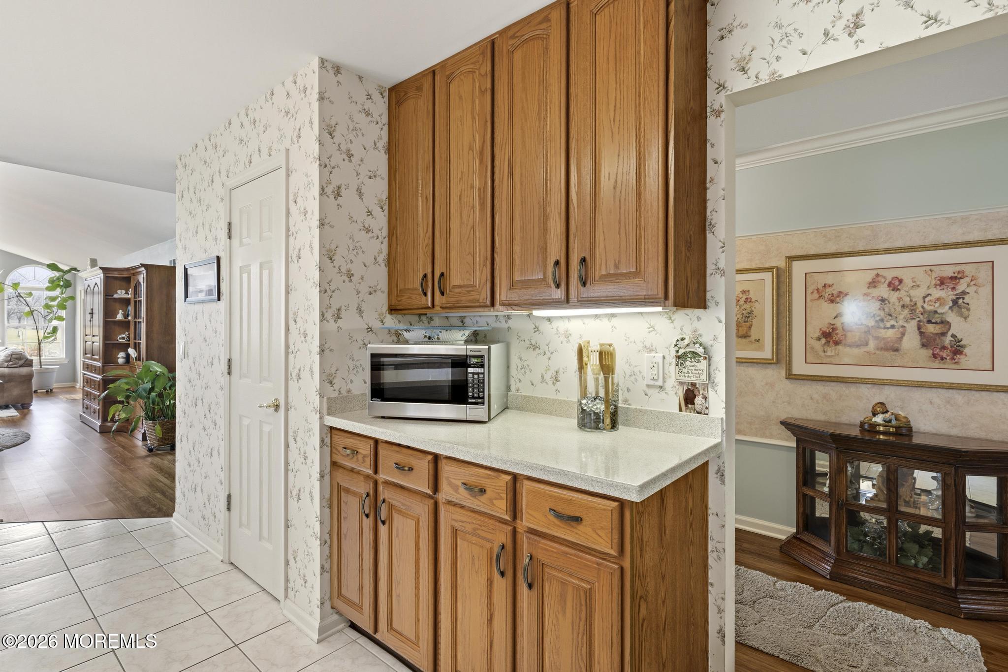 62 Ivy Hill Road Lakewood, NJ 08701 - Photo 19 of 62 a kitchen with stainless steel appliances granite countertop a refrigerator and a stove with wooden floor