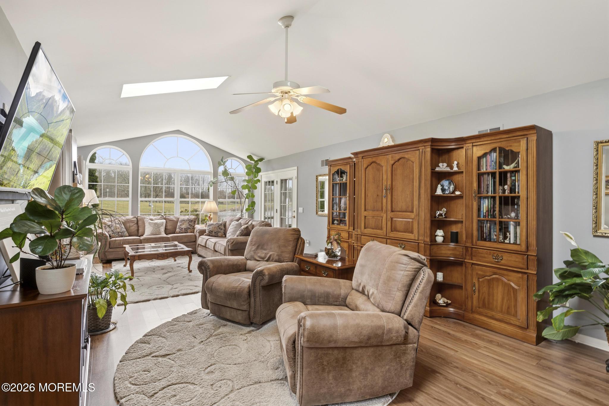 62 Ivy Hill Road Lakewood, NJ 08701 - Photo 26 of 62 a living room with furniture a chandelier and a large mirror