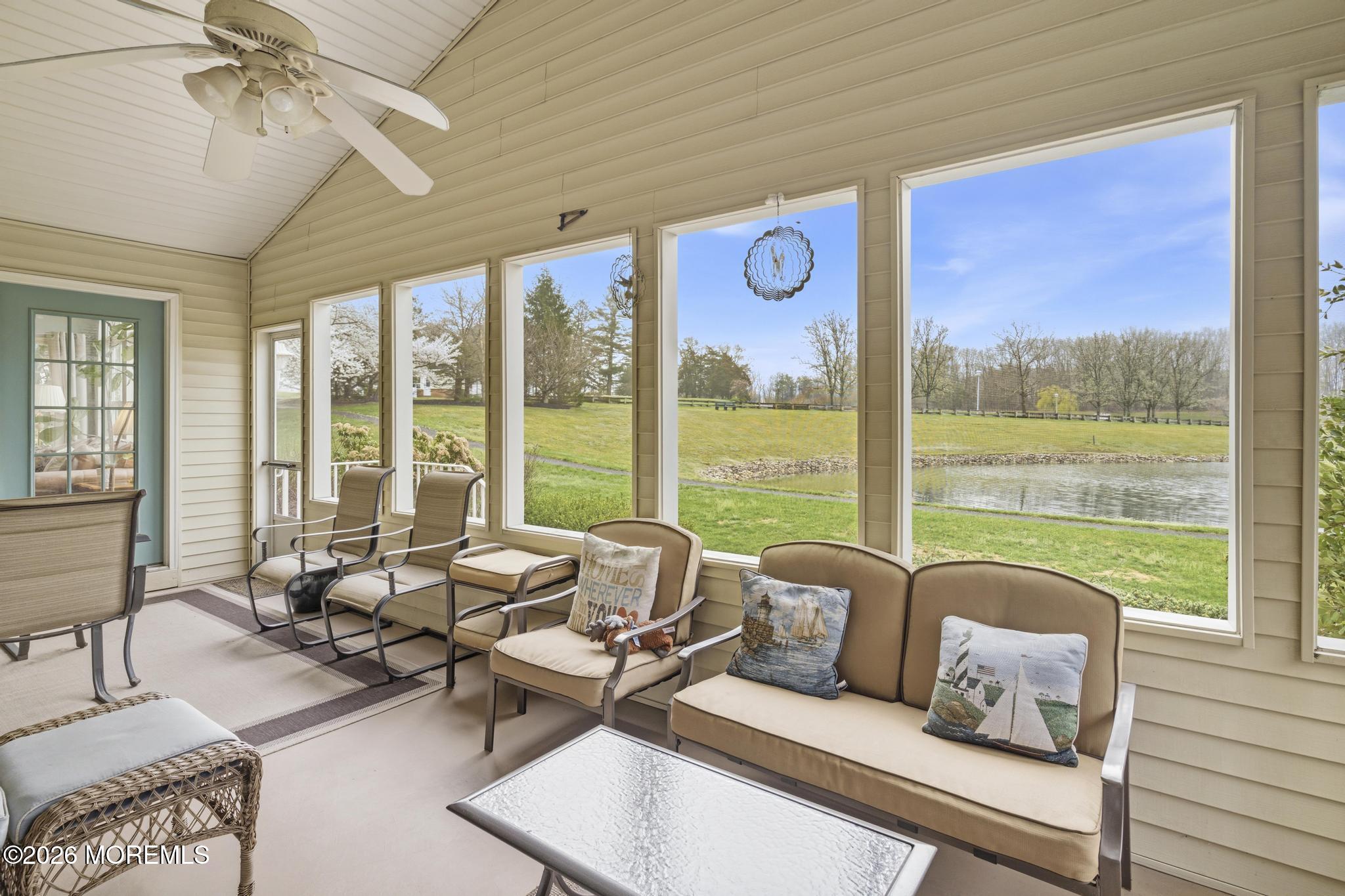 62 Ivy Hill Road Lakewood, NJ 08701 - Photo 33 of 62 a living room with furniture and floor to ceiling windows