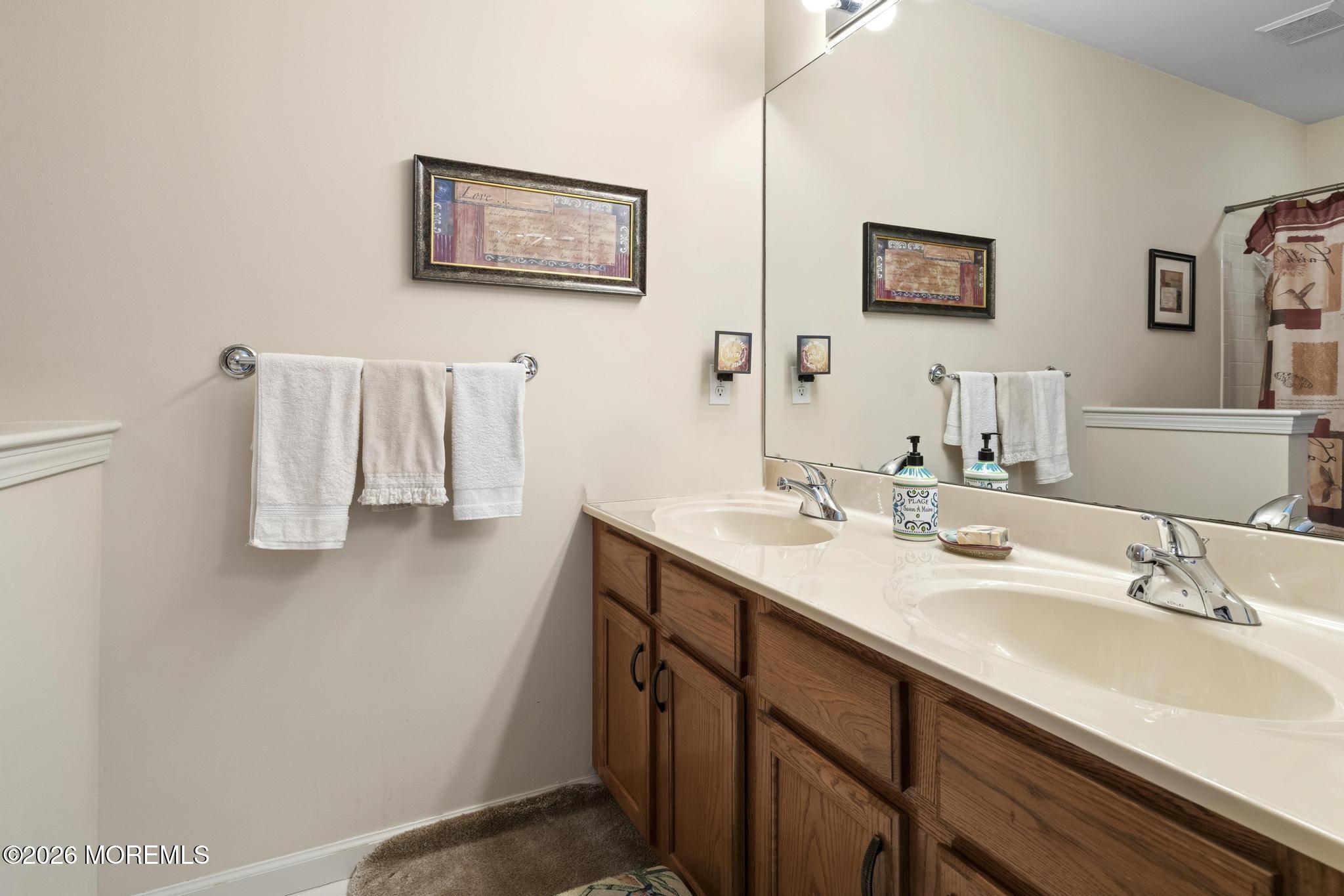 62 Ivy Hill Road Lakewood, NJ 08701 - Photo 41 of 62 a bathroom with a sink and a mirror