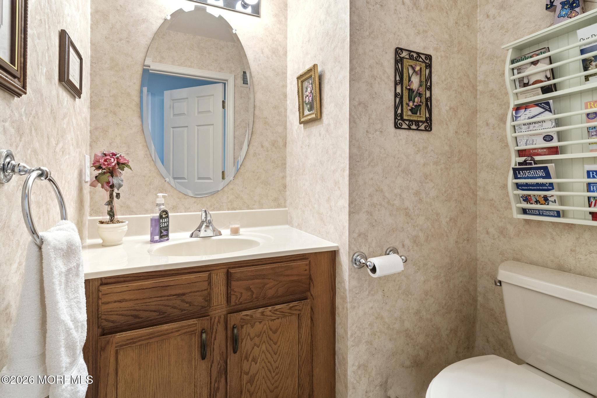 62 Ivy Hill Road Lakewood, NJ 08701 - Photo 43 of 62 a bathroom with a toilet sink and mirror