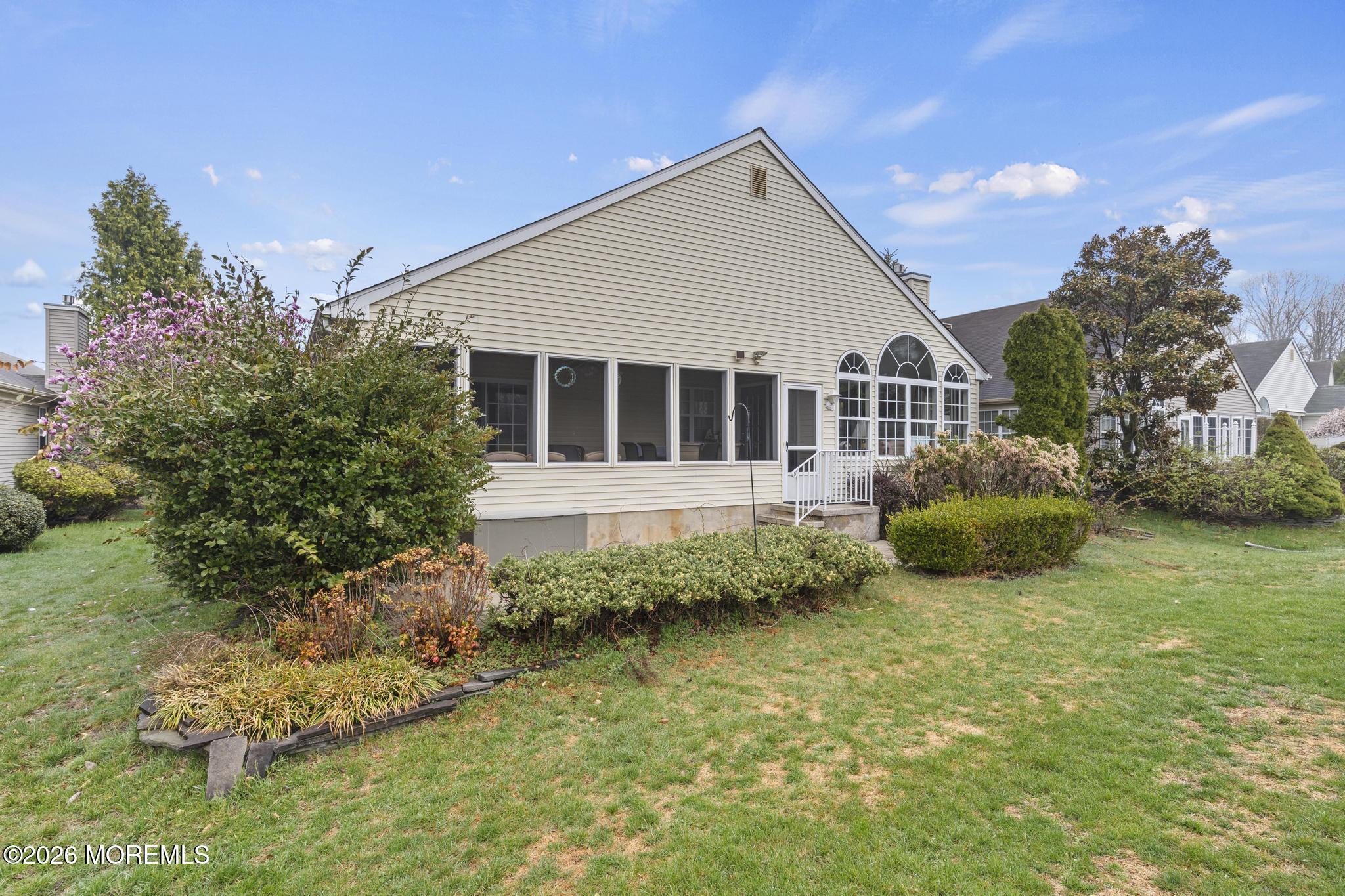62 Ivy Hill Road Lakewood, NJ 08701 - Photo 55 of 62 a view of a house with a yard and potted plants