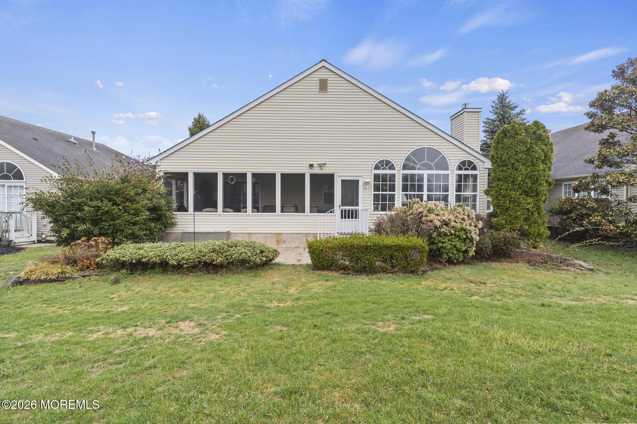 62 Ivy Hill Road Lakewood, NJ 08701 - Photo 56 of 62 a view of a house with a yard and plants