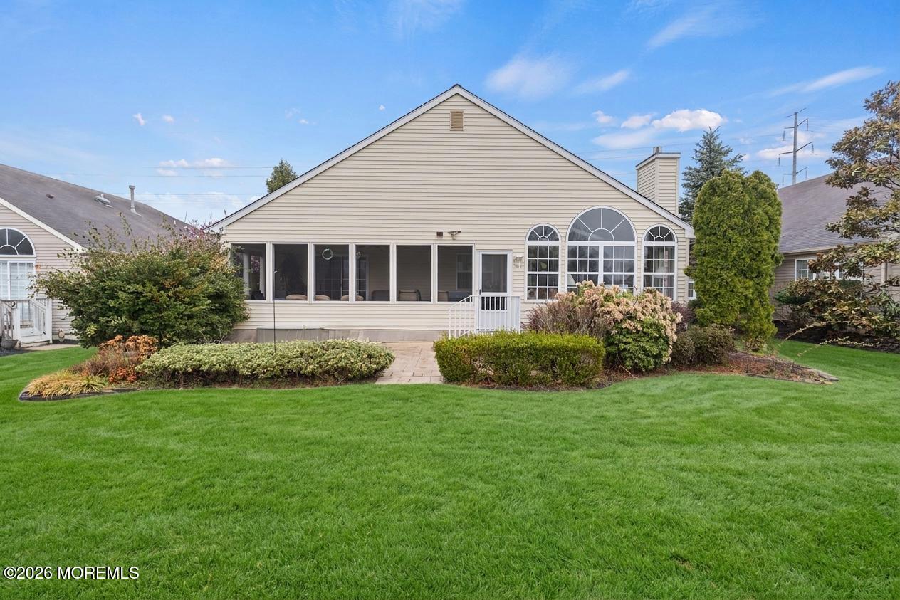 62 Ivy Hill Road Lakewood, NJ 08701 - Photo 60 of 62 a view of a house with a yard and plants