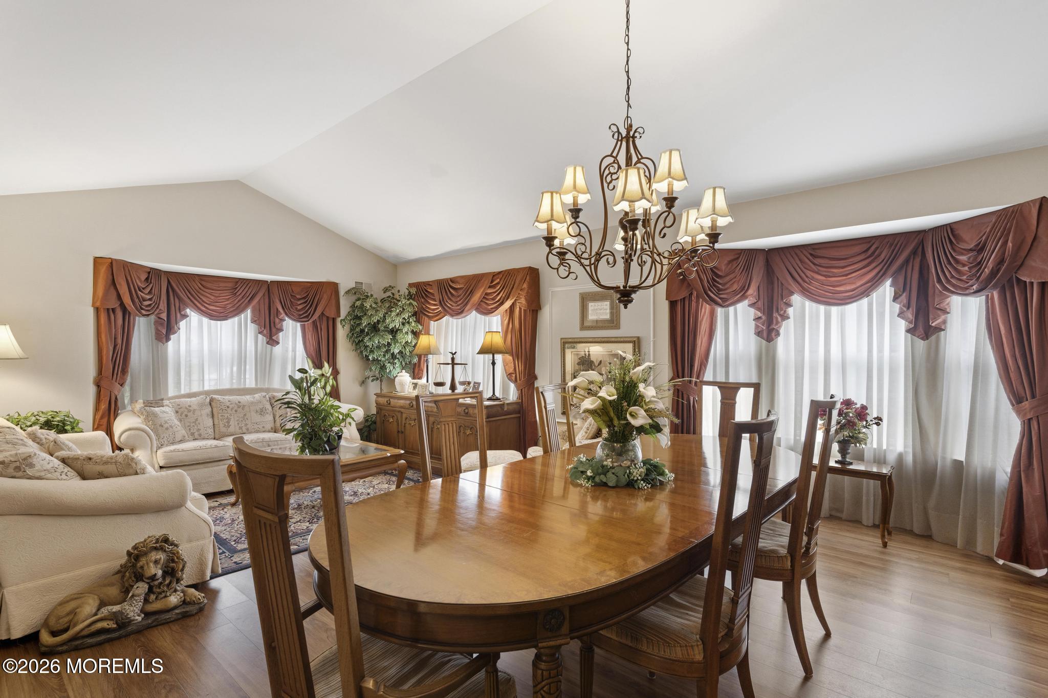 62 Ivy Hill Road Lakewood, NJ 08701 - Photo 9 of 62 a dining room with furniture a chandelier and wooden floor