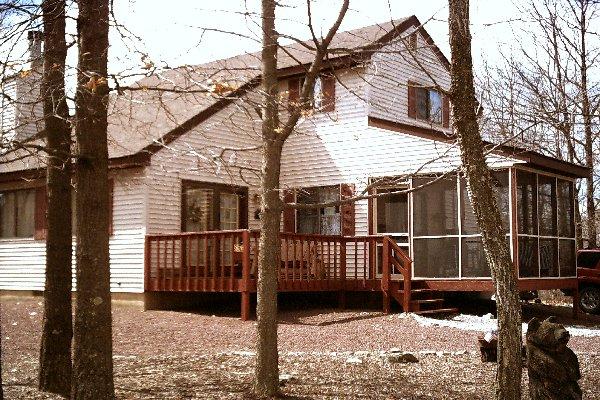 85 Huffman Bushkill Pa Bushkill, PA 18324 - Photo 1 of 1 a view of a house with a wooden deck