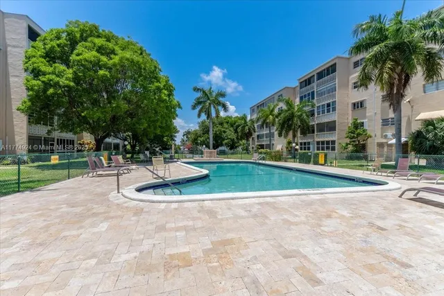 a view of a fountain in front of a house