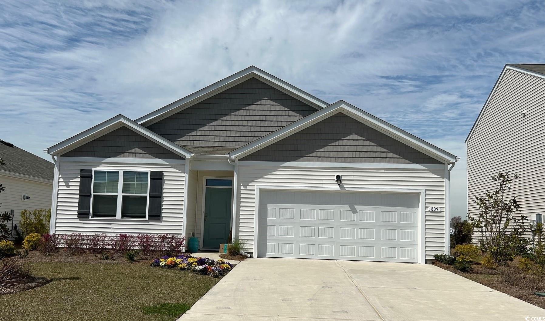 809 Grn Gdn Way Myrtle Beach, SC 29579 - Photo 1 of 16 View of front of home featuring concrete driveway,