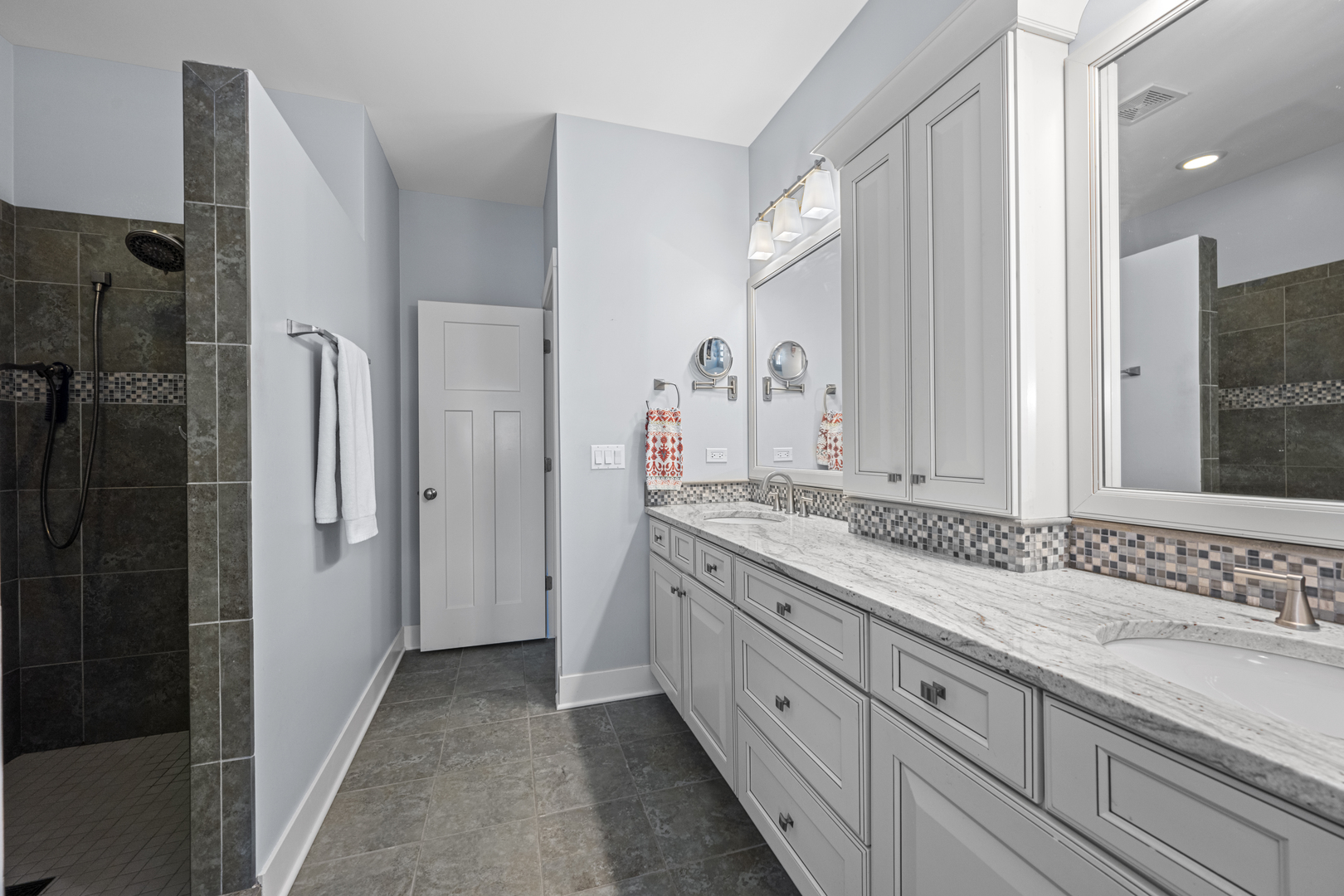 2035 Windham Circle Wheaton, IL 60187 - Photo 19 of 40 a bathroom with a granite countertop double vanity sink and mirror