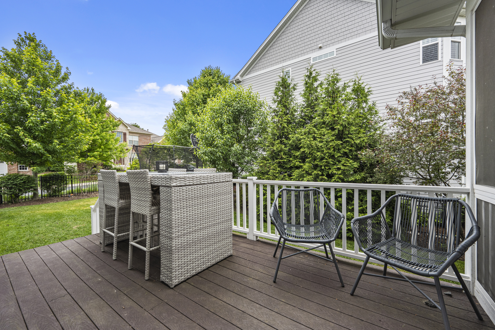 2035 Windham Circle Wheaton, IL 60187 - Photo 33 of 40 a view of a deck with a table and chairs with wooden floor and fence