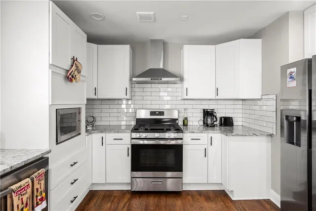 a kitchen with a sink and a stove top oven