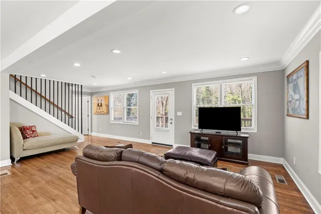 a room with furniture and a flat screen tv