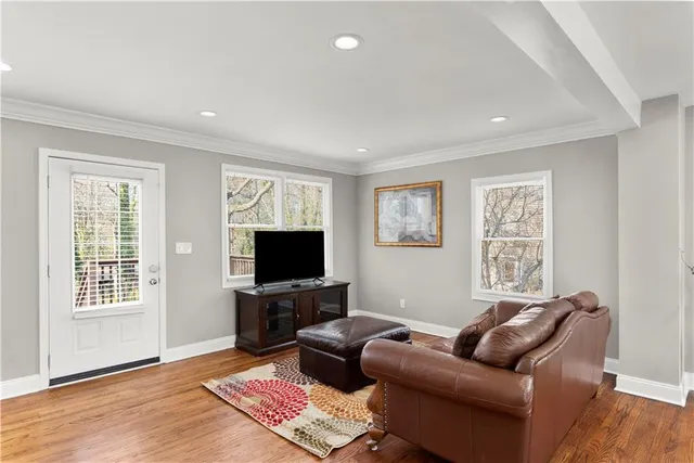 a view of a dining room with furniture window and wooden floor