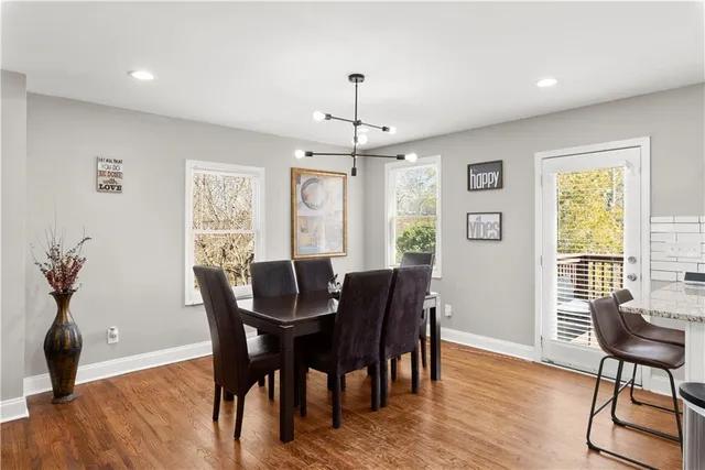a view of a dining room with furniture window and wooden floor
