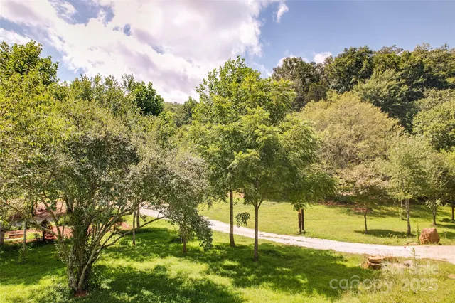 a view of a yard covered with snow in front of house