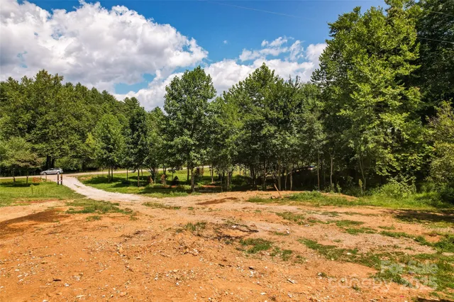 a view of a lake with a yard
