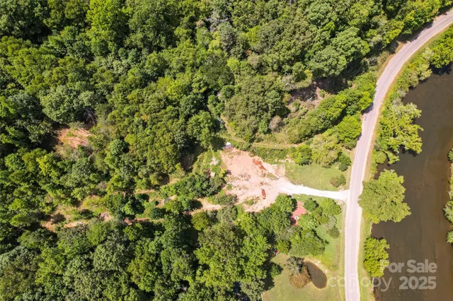 an aerial view of a houses with yard
