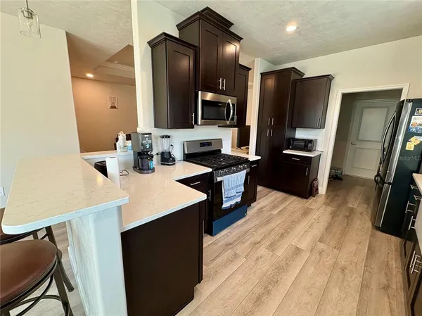 a kitchen with a sink and refrigerator