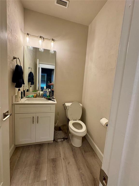 6737 Southwest 13th Lane Gainesville, FL 32607 - Photo 17 of 24 a bathroom with a sink toilet and mirror