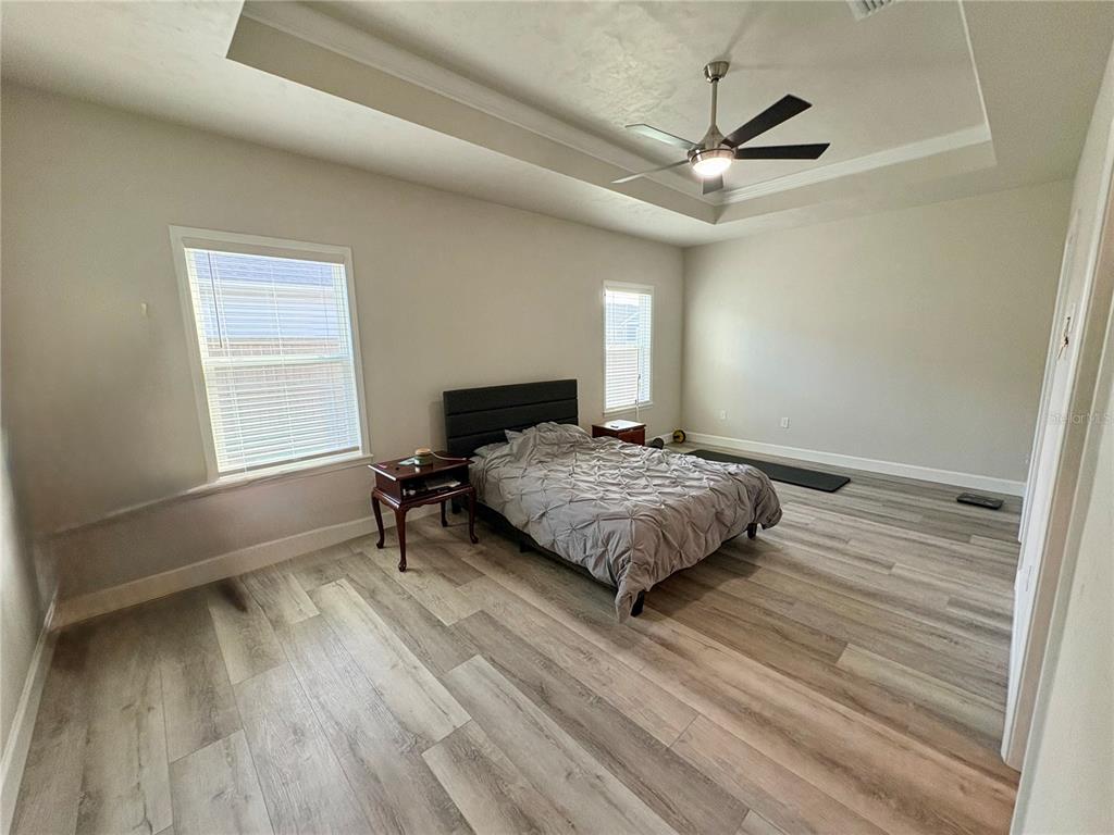 6737 Southwest 13th Lane Gainesville, FL 32607 - Photo 18 of 24 a bedroom with a bed and a window