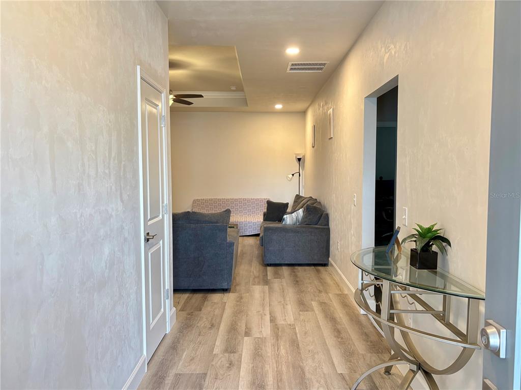 6737 Southwest 13th Lane Gainesville, FL 32607 - Photo 4 of 24 a living room with furniture and a potted plant