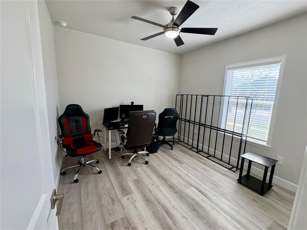 6737 Southwest 13th Lane Gainesville, FL 32607 - Photo 6 of 24 a view of a workspace with furniture and a window