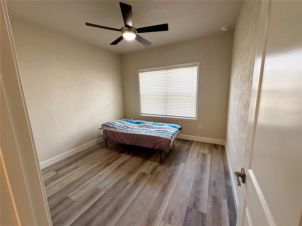 6737 Southwest 13th Lane Gainesville, FL 32607 - Photo 9 of 24 a view of workspace with wooden floor and window