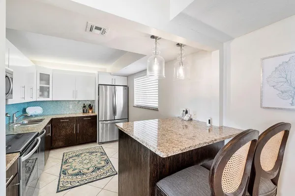 a bedroom with a bed and glass window