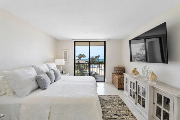 a bathroom with a granite countertop sink mirror vanity and toilet