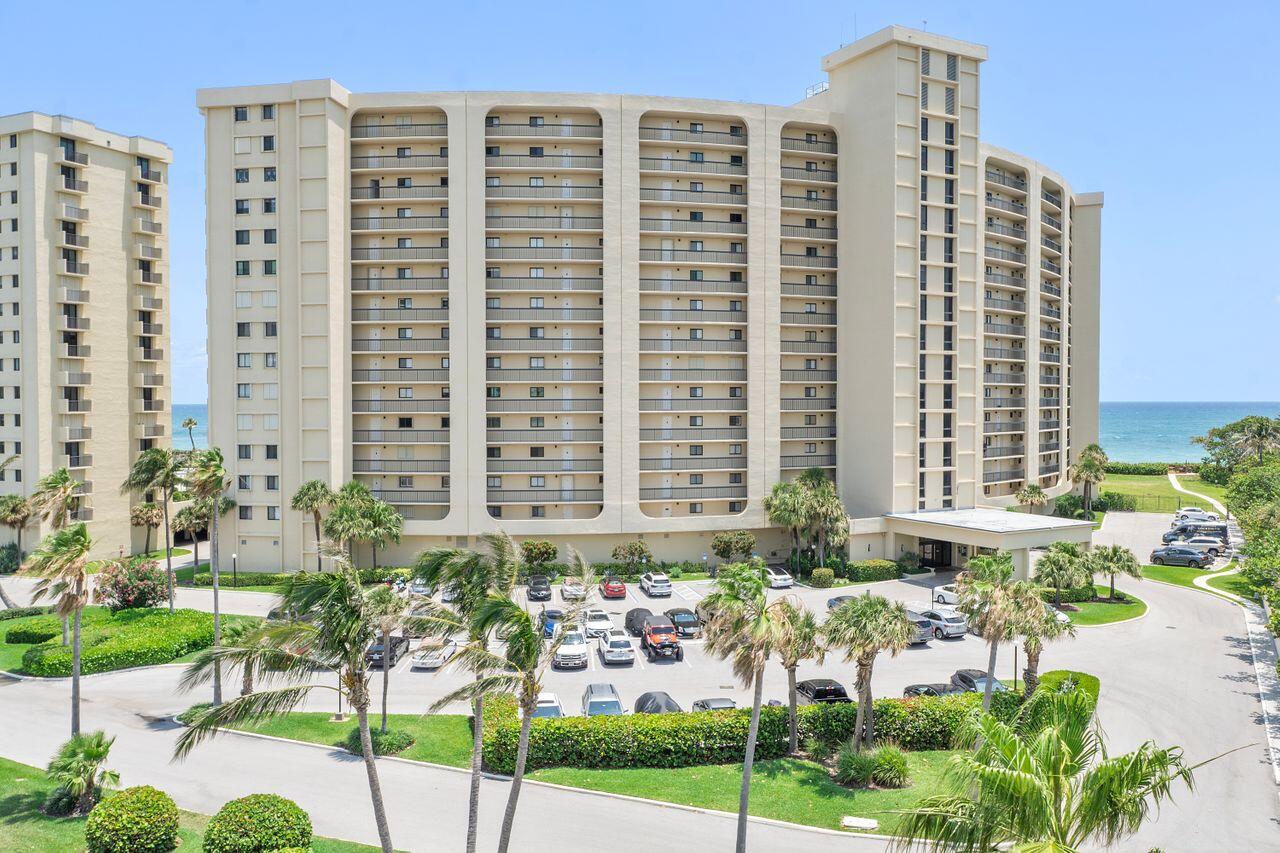 100 Ocean Trail Way, Unit 207 Jupiter, FL 33477 - Photo 2 of 61 a front view of a building with outdoor seating