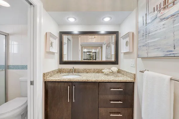 a bedroom with two beds and a window