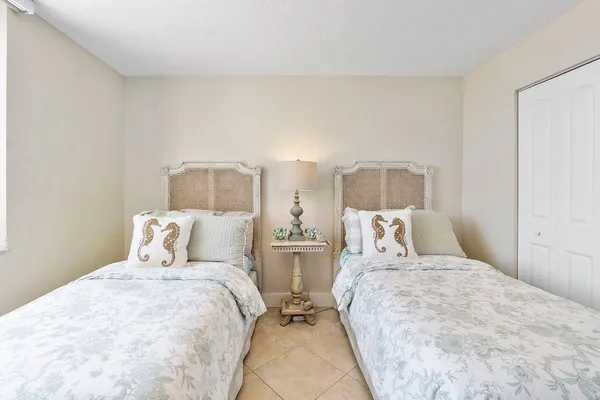 a bathroom with a sink vanity mirror and toilet