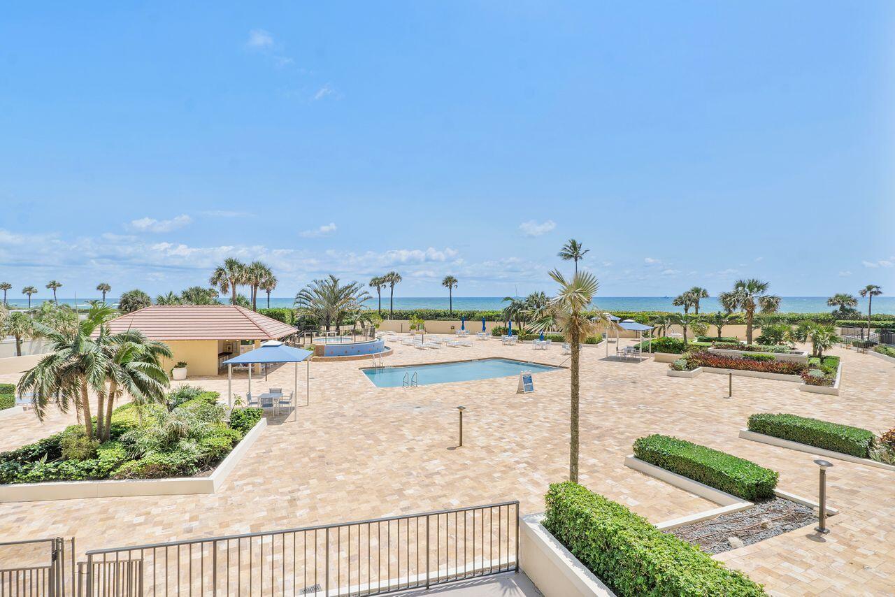 100 Ocean Trail Way, Unit 207 Jupiter, FL 33477 - Photo 38 of 61 a view of a swimming pool and an ocean view