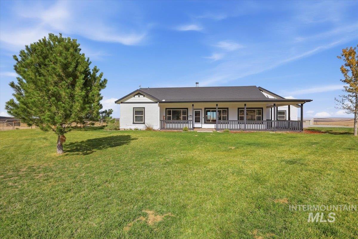 18026 Briar Creek Road Murphy, ID 83650 - Photo 1 of 50 Expansive property featuring multiple outbuildings, fenced enclosures, a round pen, and a residence with a paved driveway