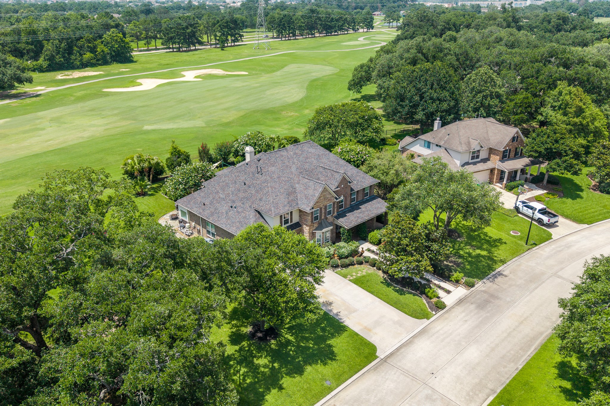 5914 Oakmoss Trail Spring, TX 77379 - Photo 39 of 50 Great aerial view of the 18th hole of Windrose Golf Course located just behind your next home!