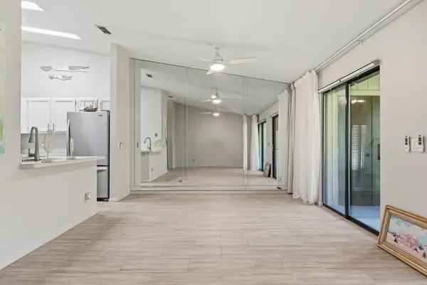 a view of a hallway with a flower pot