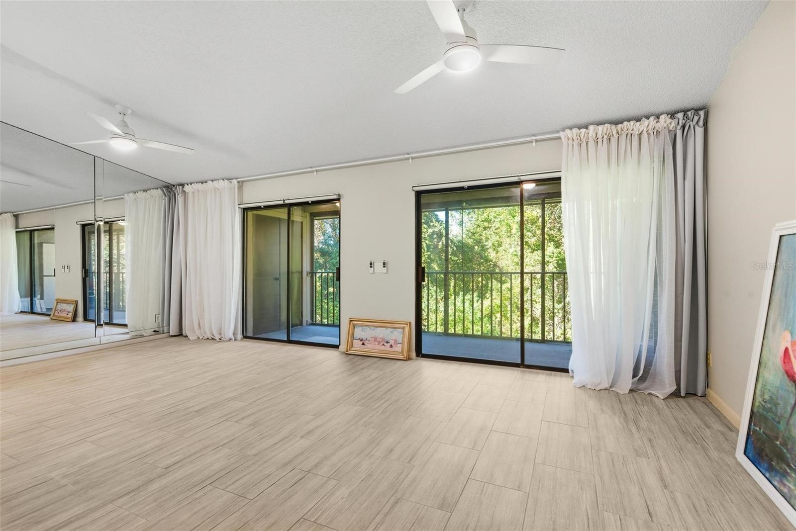 32 Navarra Court St. Augustine Shores, FL 32086 - Photo 11 of 40 an empty room with wooden floor and windows