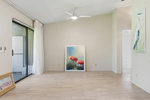 a view of a hallway with wooden shelves