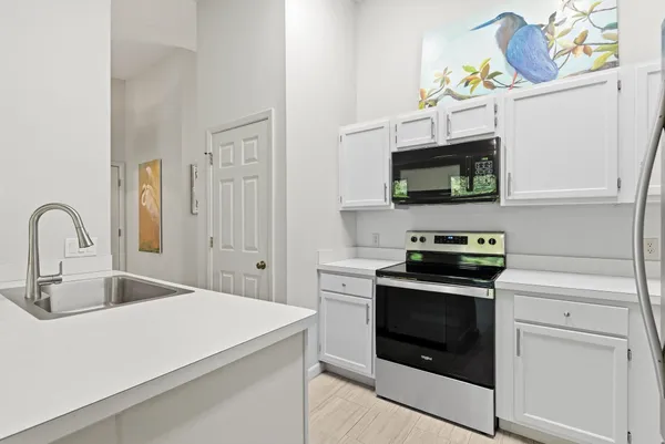 a view of a hallway with wooden shelves