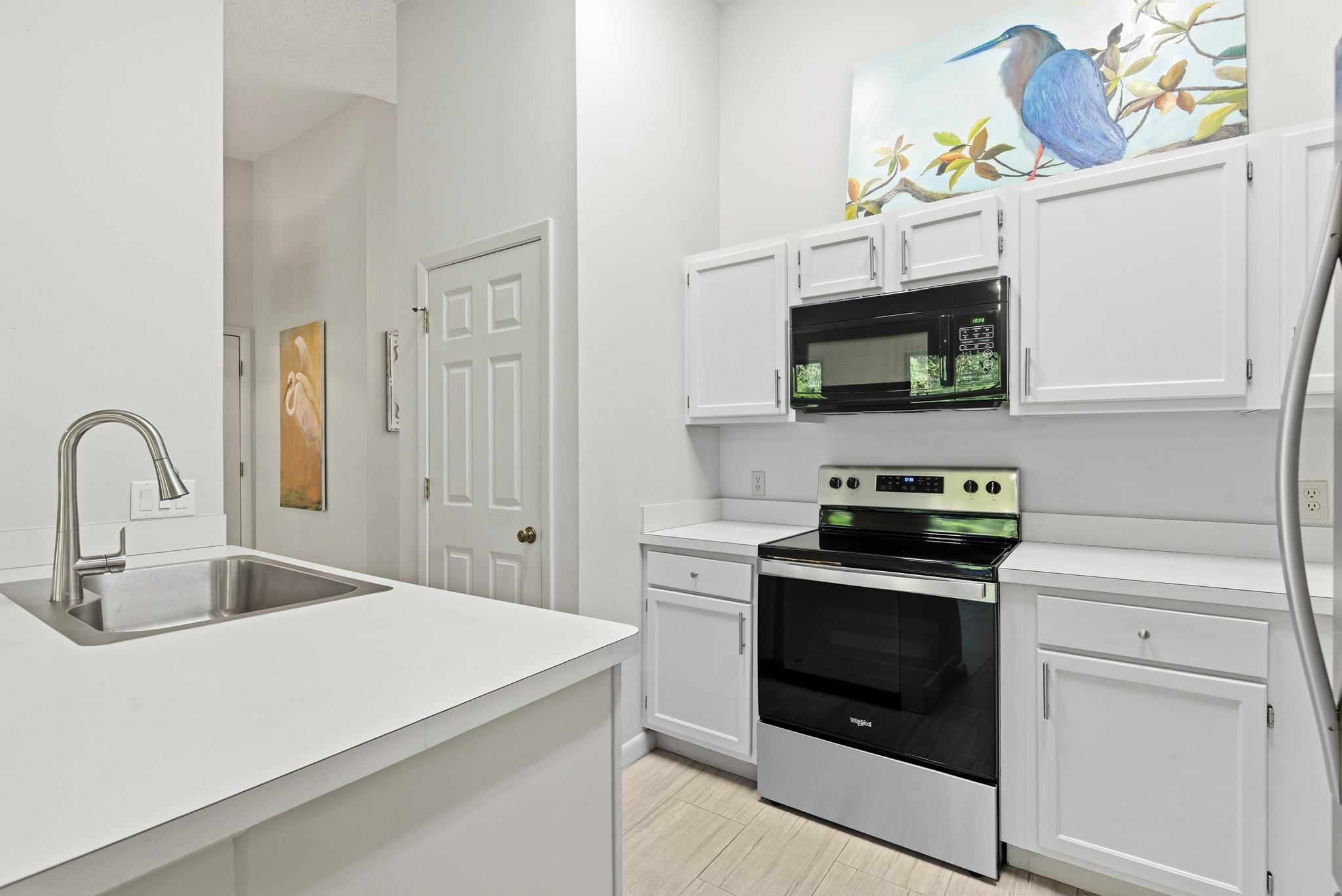 32 Navarra Court St. Augustine Shores, FL 32086 - Photo 16 of 40 a kitchen with a stove and a sink
