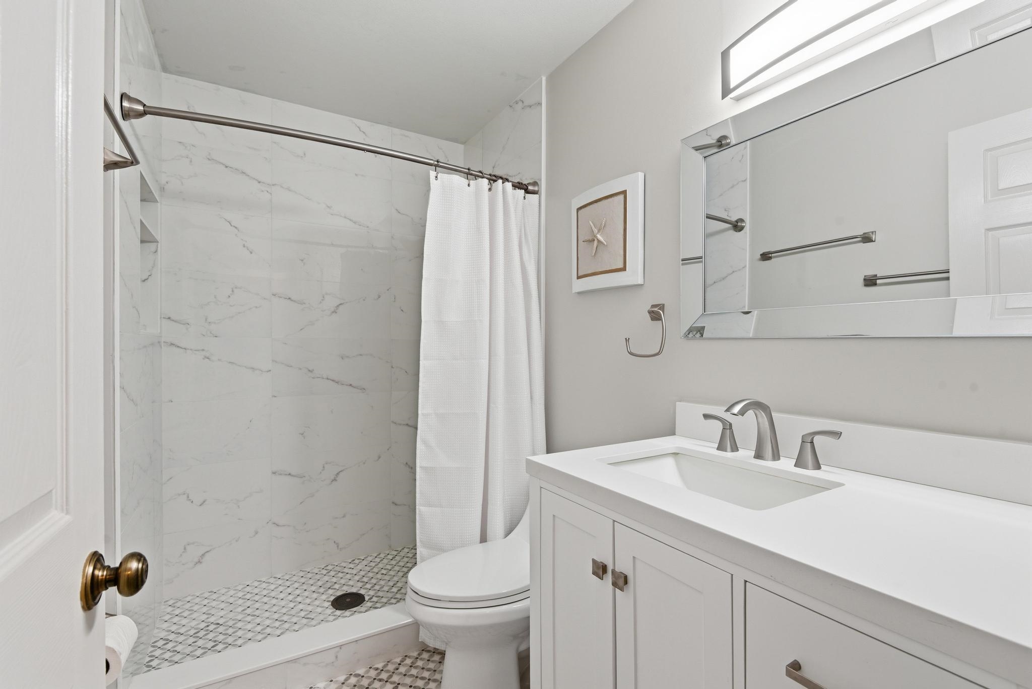 32 Navarra Court St. Augustine Shores, FL 32086 - Photo 20 of 40 a bathroom with a sink shower and a mirror