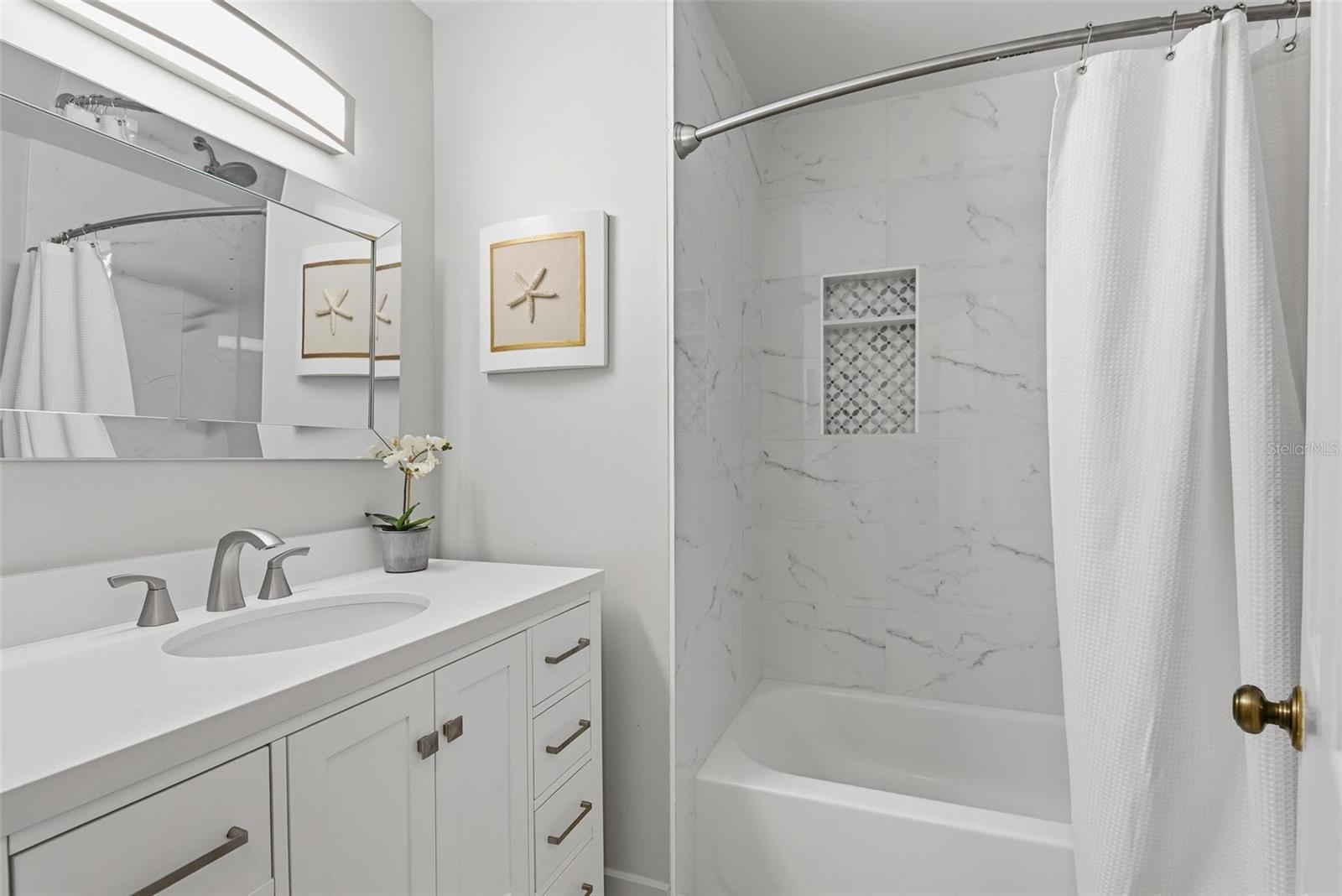 32 Navarra Court St. Augustine Shores, FL 32086 - Photo 22 of 40 a bathroom with a sink and a mirror