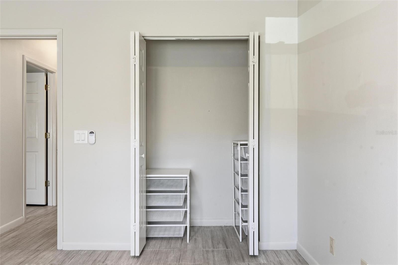 32 Navarra Court St. Augustine Shores, FL 32086 - Photo 24 of 40 an empty room with wooden floor closet and windows